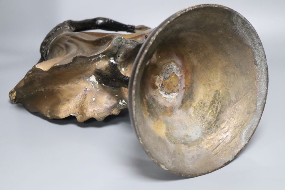 A patinated metal model of a 1930s dancer, on stepped circular base, 48cm